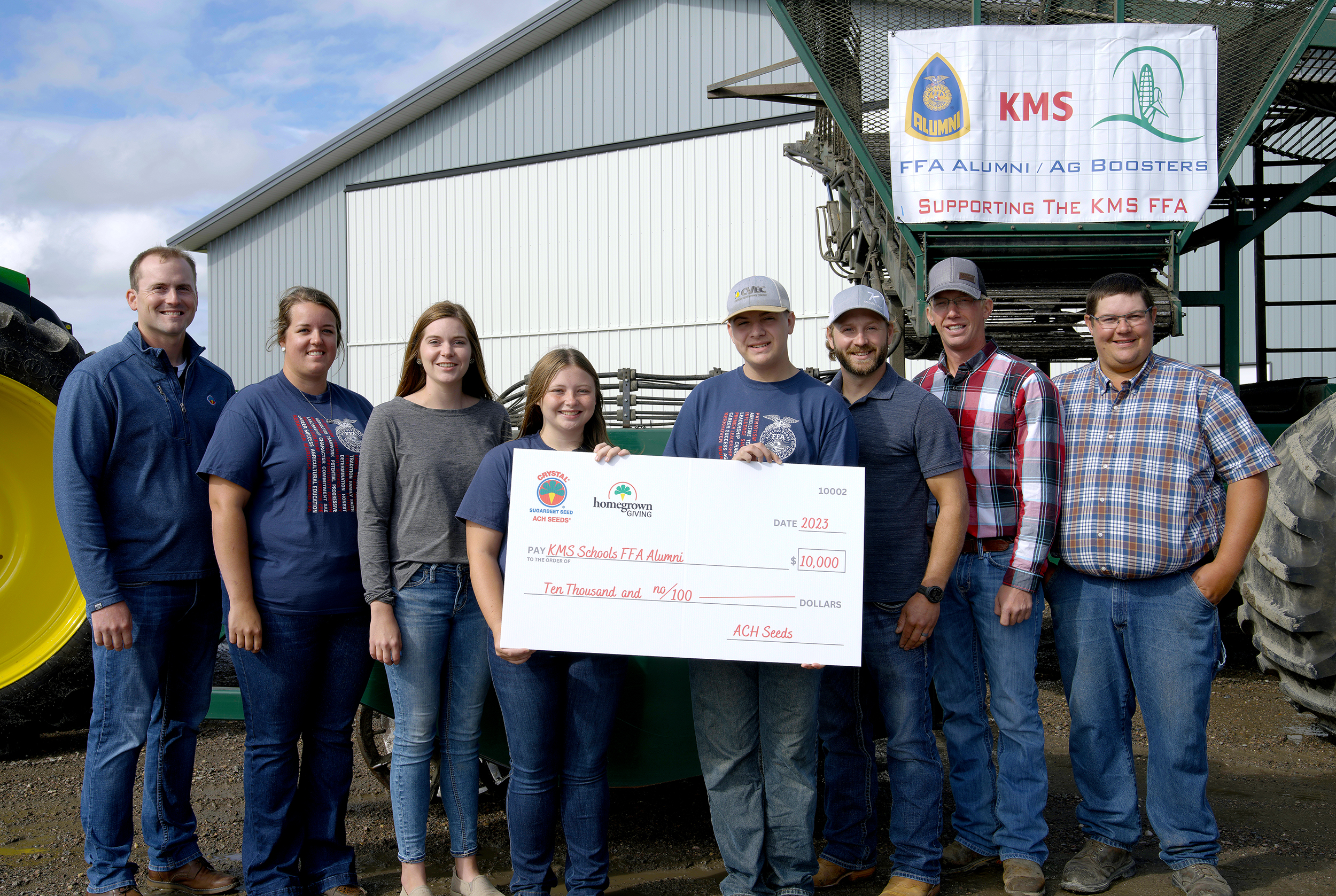 kms schools ffa holding their check