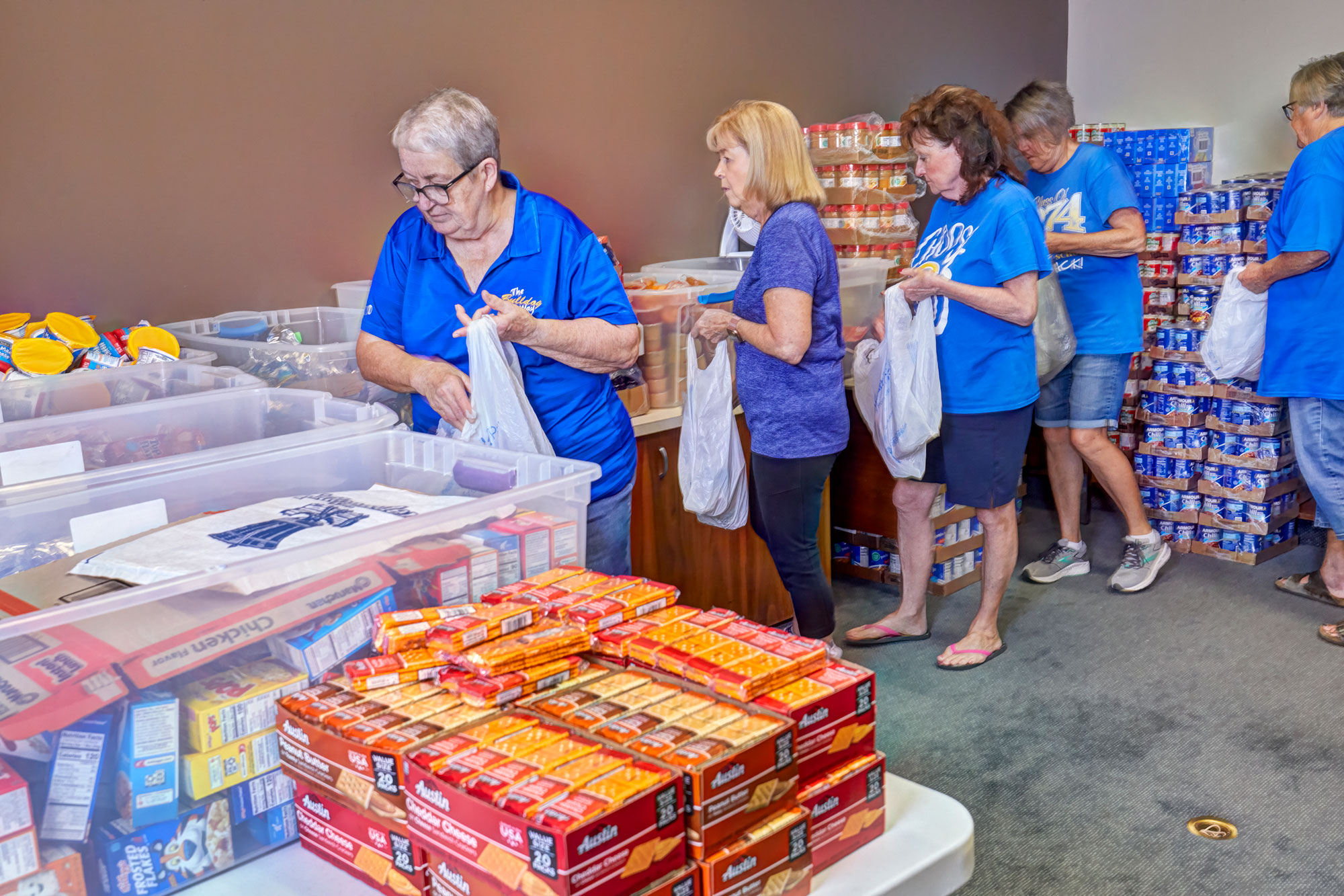 volunteers filling backpacks